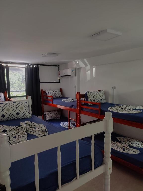 a bedroom with three bunk beds in a boat at Hostel Princess Copacabana in Rio de Janeiro