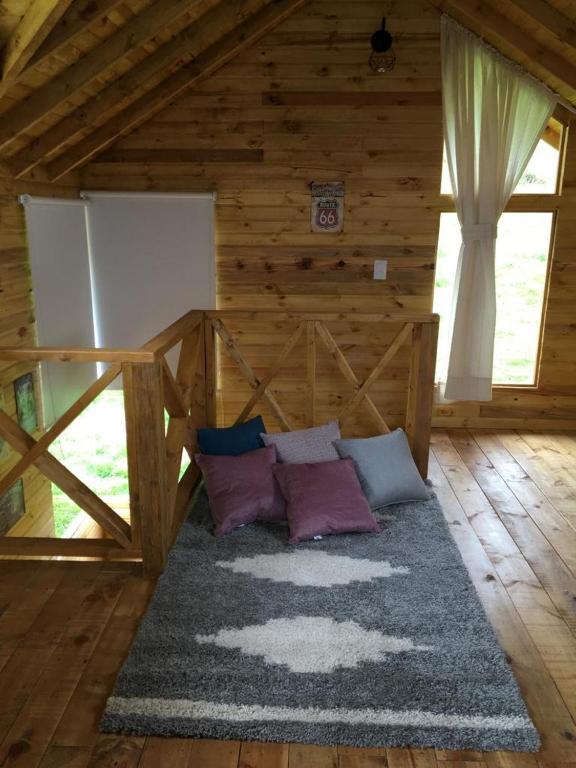 Postel nebo postele na pokoji v ubytování Altozano Cabañas