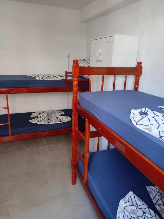 a bedroom with two bunk beds in a room at Hostel Princess Copacabana in Rio de Janeiro