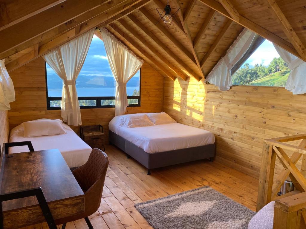 Postel nebo postele na pokoji v ubytování Altozano Cabañas