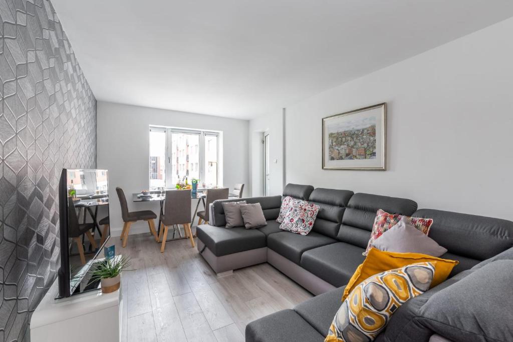 a living room with a couch and a table at Sweet Inn - Adelaide Square in Dublin