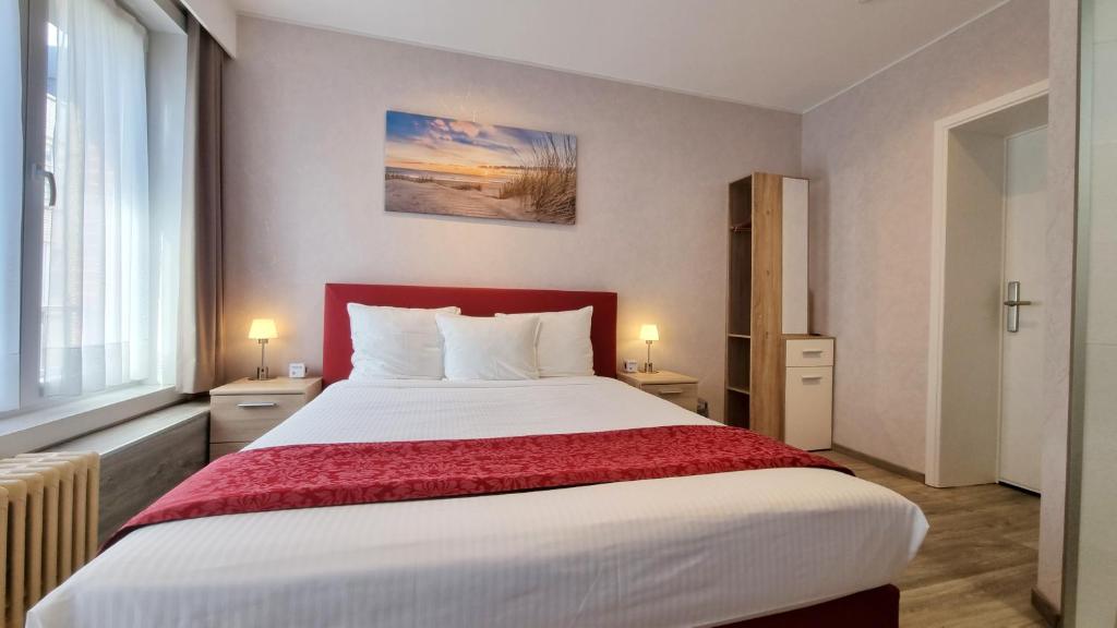 Postel nebo postele na pokoji v ubytování Hotel Cardiff