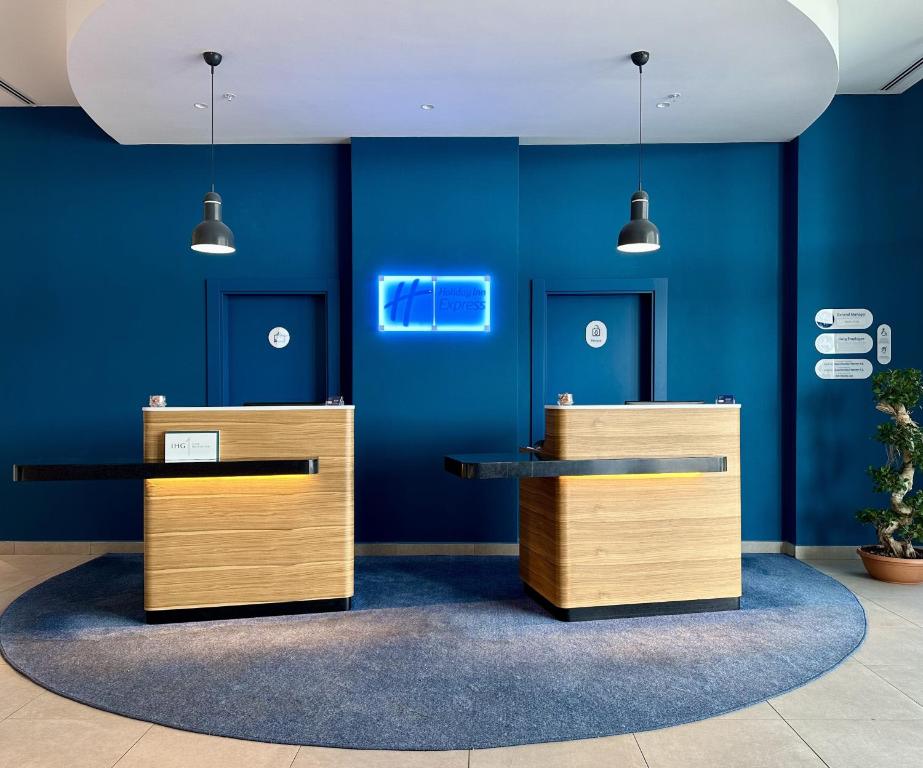 a room with blue walls and two counters at Holiday Inn Express - Ankara - Airport by IHG in Ankara