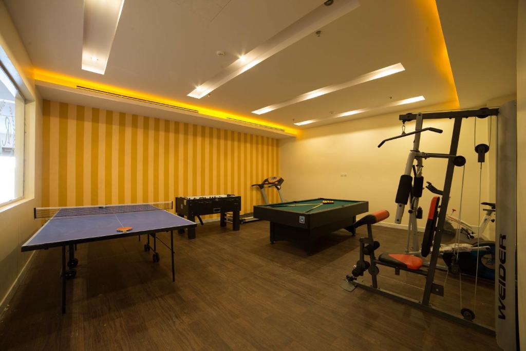 Fitness centrum a/nebo fitness zařízení v ubytování رؤوم إن للشقق الفندقية-Raoum Inn Hotel Apartments