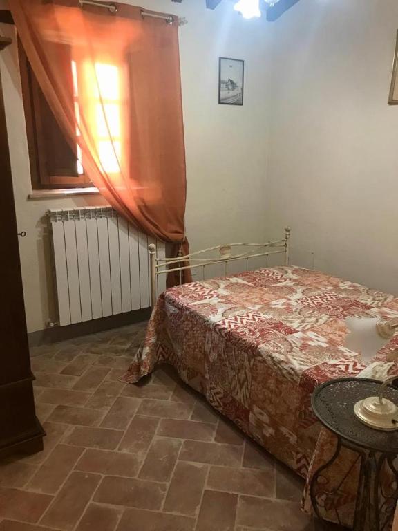Postel nebo postele na pokoji v ubytování Borgo Chiantina