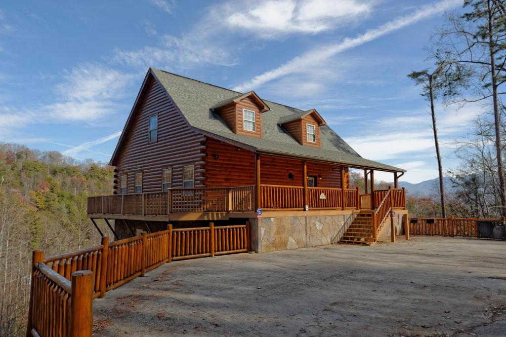 a large wooden house with a large deck at Redneck Ritz #724 in Gatlinburg