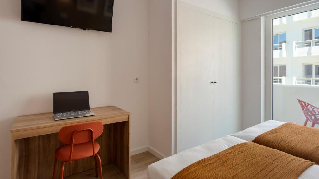 TV a/nebo společenská místnost v ubytování Hotel Made inn Faro