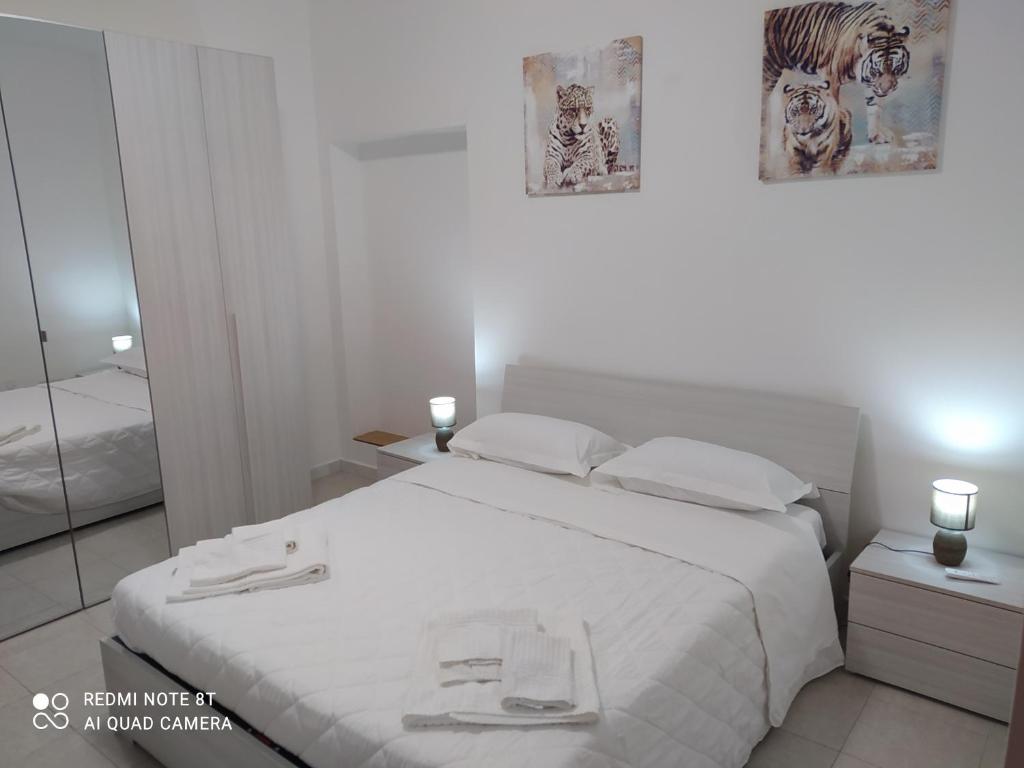 Postel nebo postele na pokoji v ubytování La casetta di Alessandro