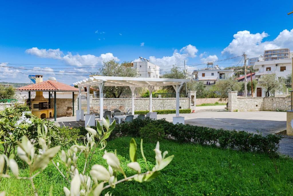 a pavilion with a gazebo in a yard at Garden Villa Landi in Ksamil