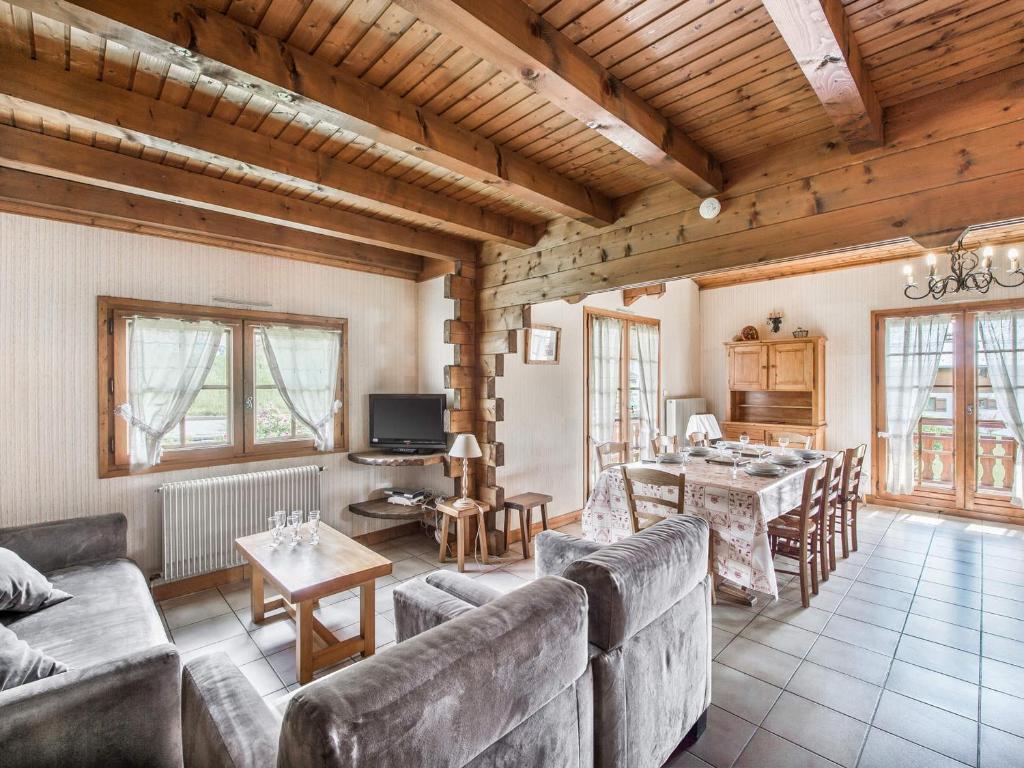 a living room with a couch and a table at Chalet Megève, 5 pièces, 8 personnes - FR-1-453-233 in Megève