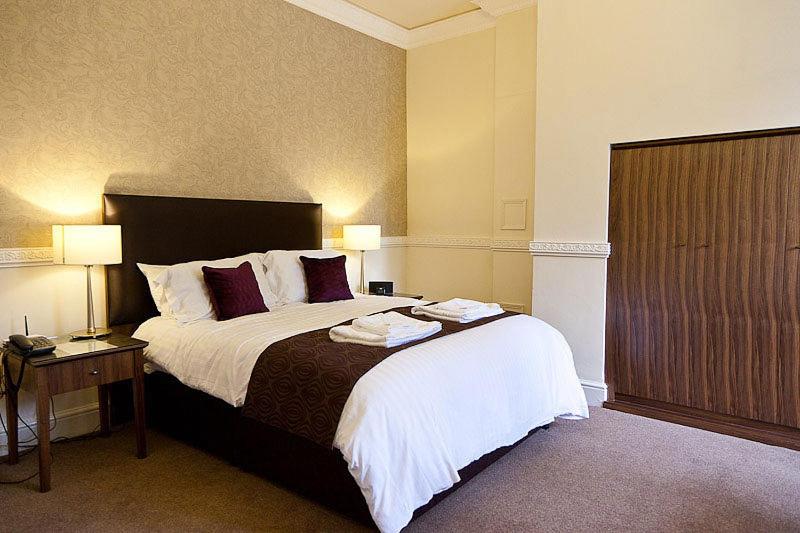 Ένα ή περισσότερα κρεβάτια σε δωμάτιο στο Budget Inn and Suites Mount Ephraim