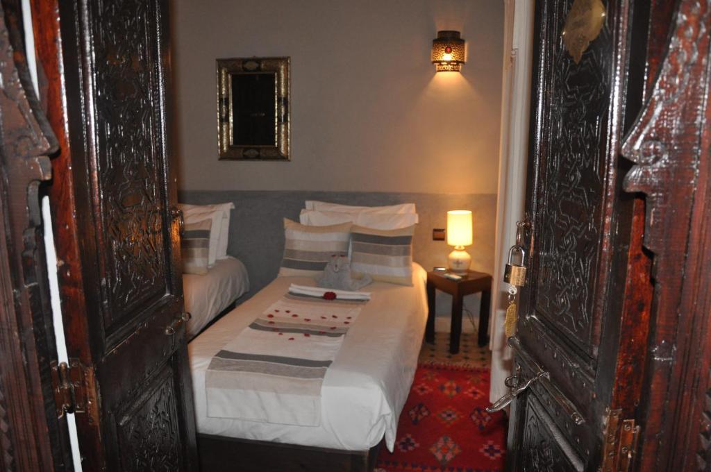 Postel nebo postele na pokoji v ubytování Riad des Etoiles