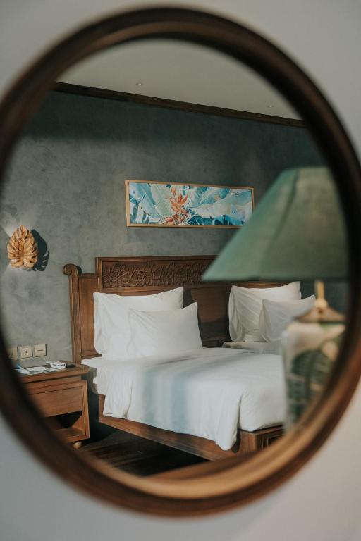 Postel nebo postele na pokoji v ubytování Amour Resort Bavi
