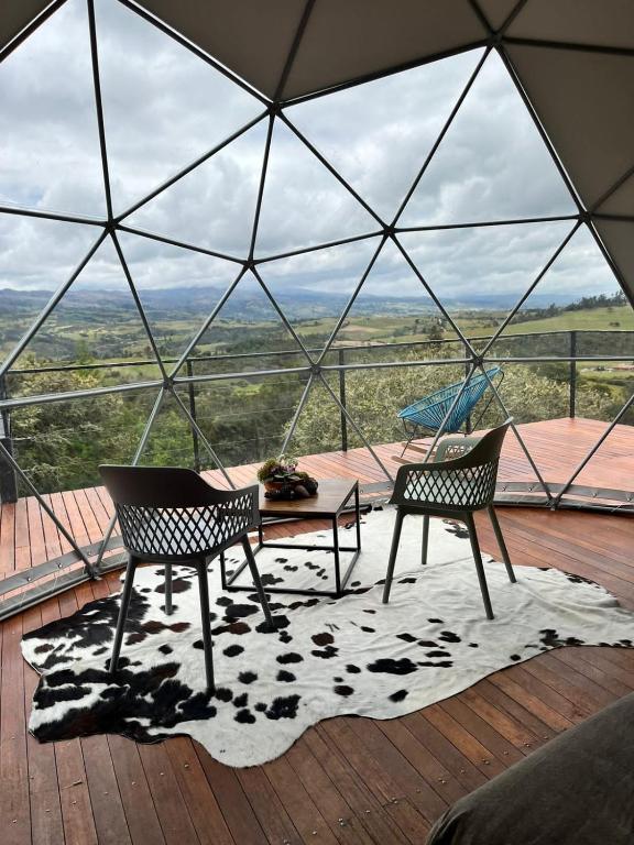 Balkón nebo terasa v ubytování Glamping Altos De Hayuelos