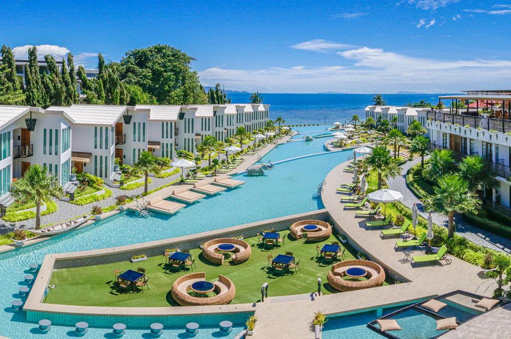 an aerial view of a resort with a pool at Vannee Golden Sands Beachfront Resort in Haad Rin