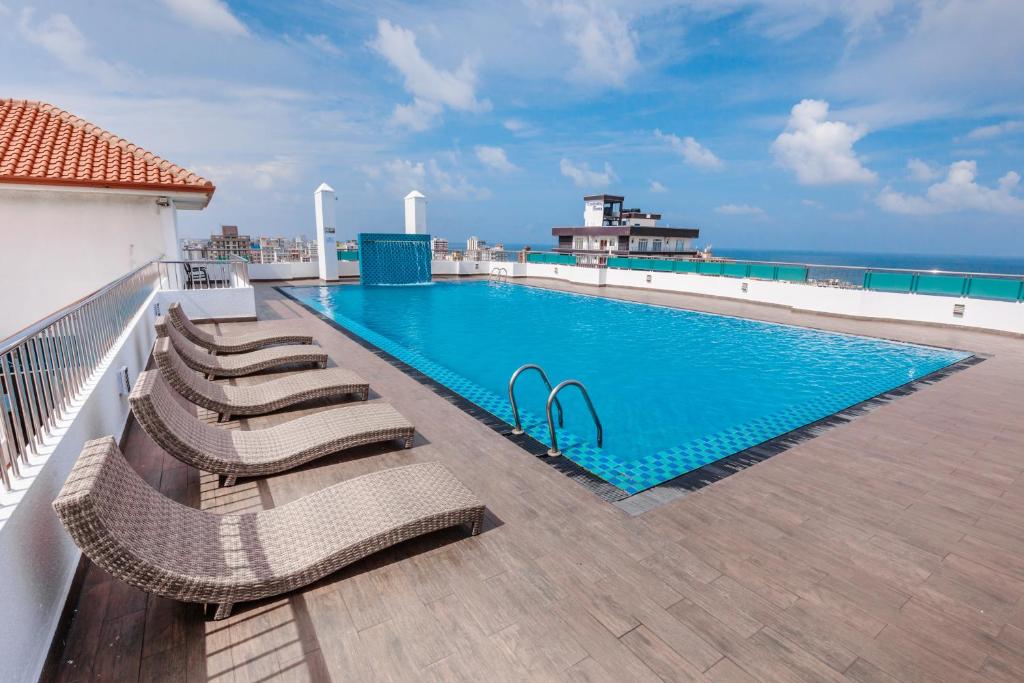 a swimming pool on the roof of a building at Supun Arcade Residency in Colombo