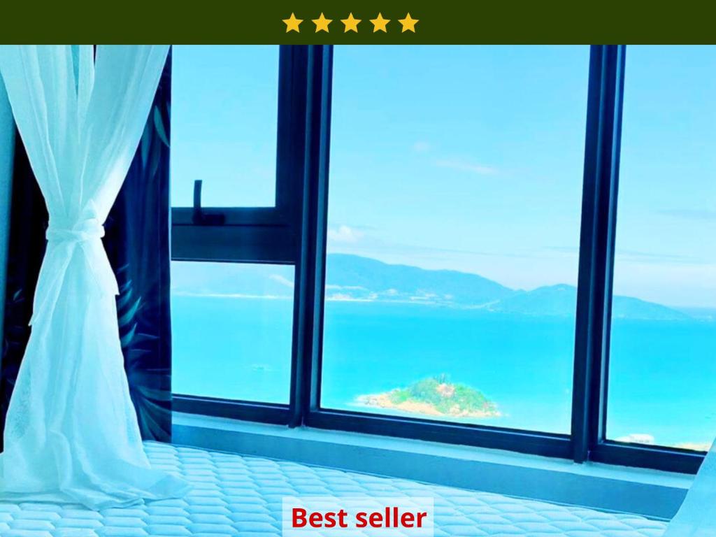 a bedroom with a window view of the ocean at Muong Thanh Vien Trieu Nha Trang Apartment - Review Nha Trang in Nha Trang
