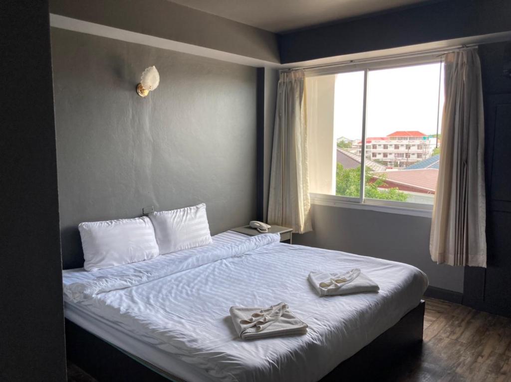 Postel nebo postele na pokoji v ubytování Sun Moon Hotel