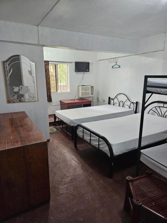 Postel nebo postele na pokoji v ubytování Antipolo Budget Hostel,Family Rooms