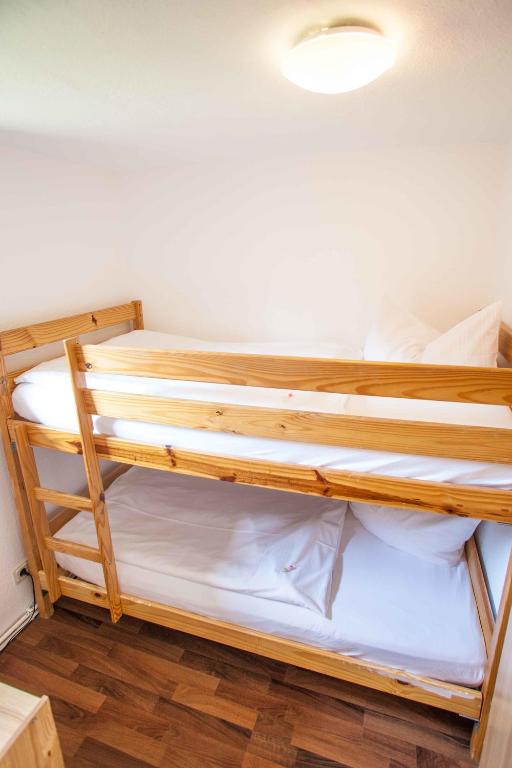 Postel nebo postele na pokoji v ubytování Hotel Im Tannengrund