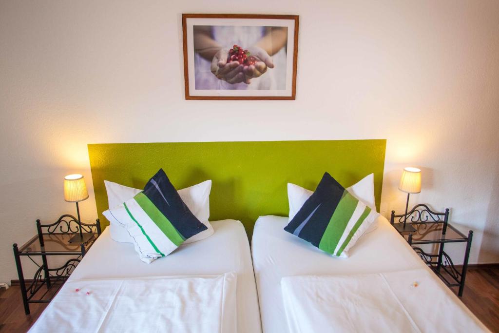 Postel nebo postele na pokoji v ubytování Hotel Im Tannengrund