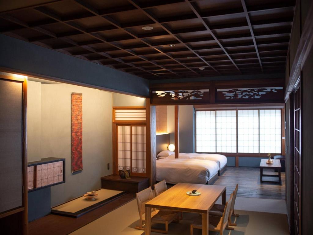 Postel nebo postele na pokoji v ubytování HOTEL VMG RESORT KYOTO