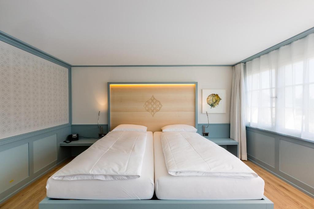 Postel nebo postele na pokoji v ubytování Hotel Krone Speicher