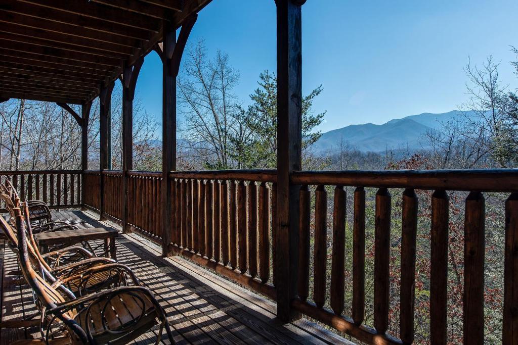 a porch with chairs and a view of the mountains at 518MTNVIEWLDGEACNCB - Mountain View Lodge in Gatlinburg