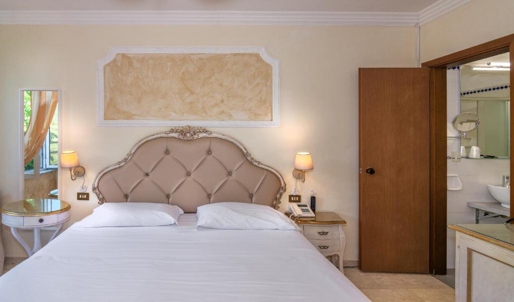 Łóżko lub łóżka w pokoju w obiekcie Hotel Tahiti