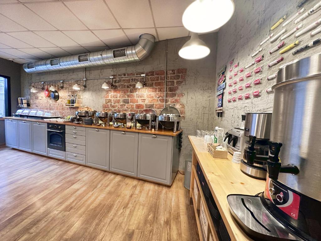 Kuchyň nebo kuchyňský kout v ubytování My Dora Hotel