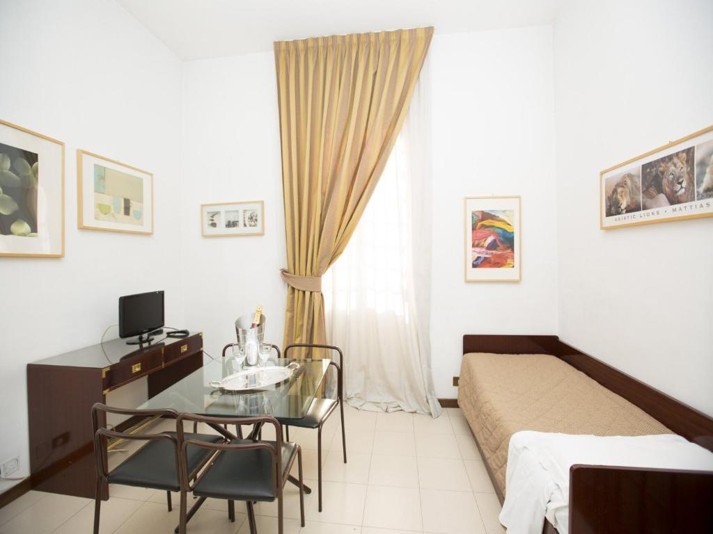 En eller flere senger på et rom på Hotel Residence Villa Tassoni