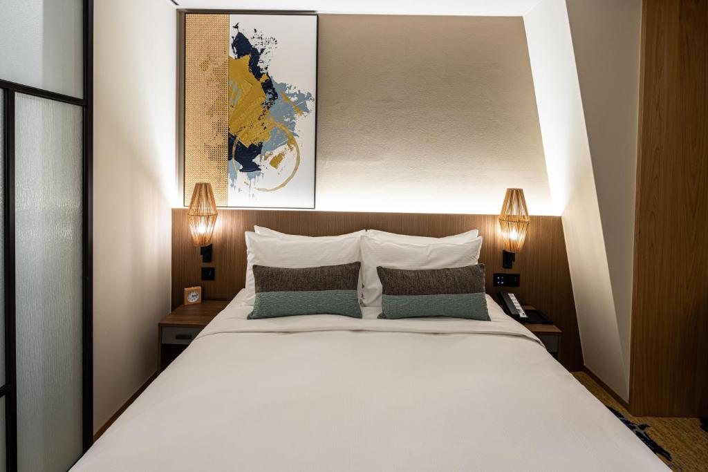 Postel nebo postele na pokoji v ubytování Solaria Nishitetsu Hotel Taipei Ximen