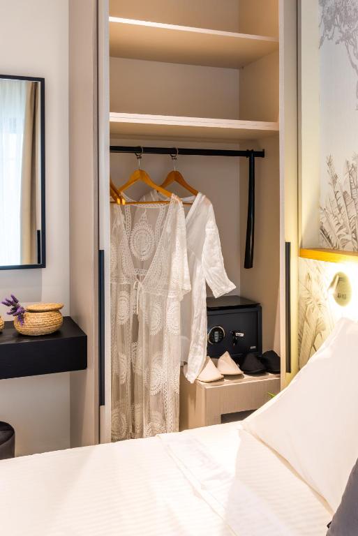 Postel nebo postele na pokoji v ubytování Hara Suites