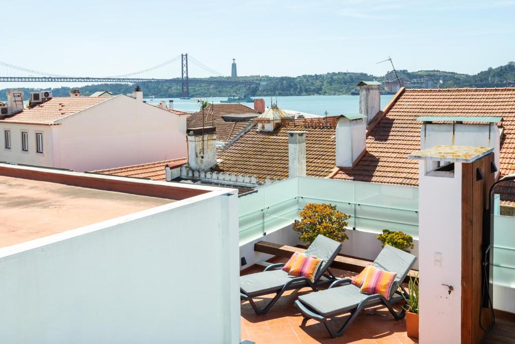 a view from the balcony of a apartment with a view of a bridge at Ambassador River Shower Suites in Lisbon