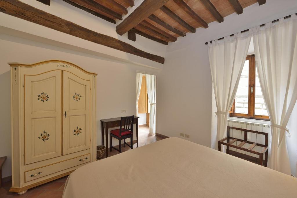 Posteľ alebo postele v izbe v ubytovaní Il Palazzetto