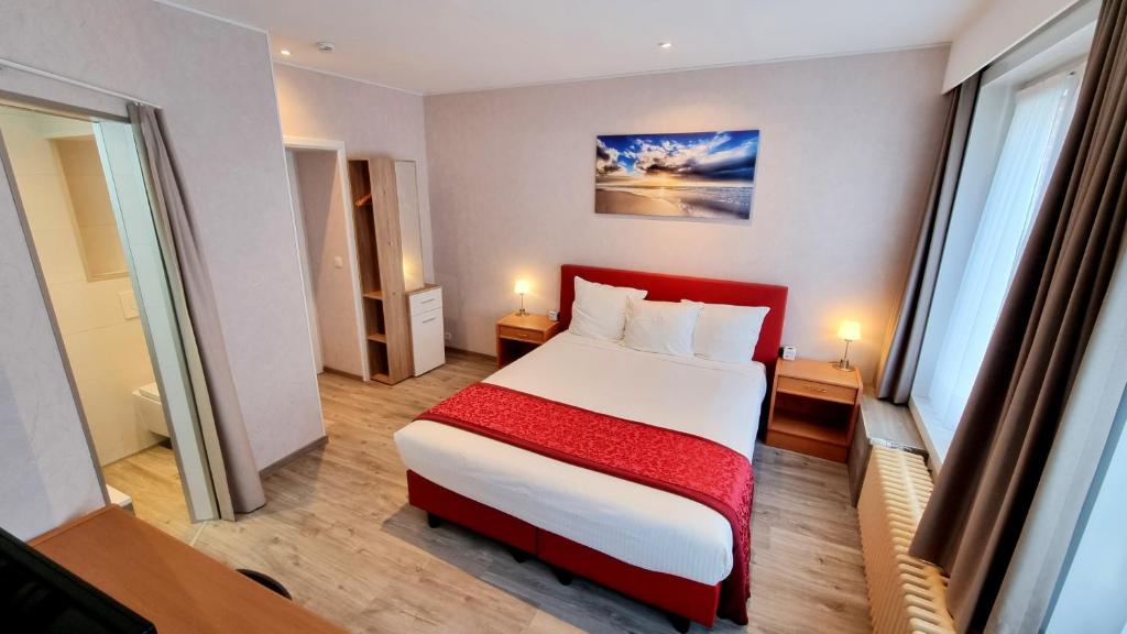 Postel nebo postele na pokoji v ubytování Hotel Cardiff