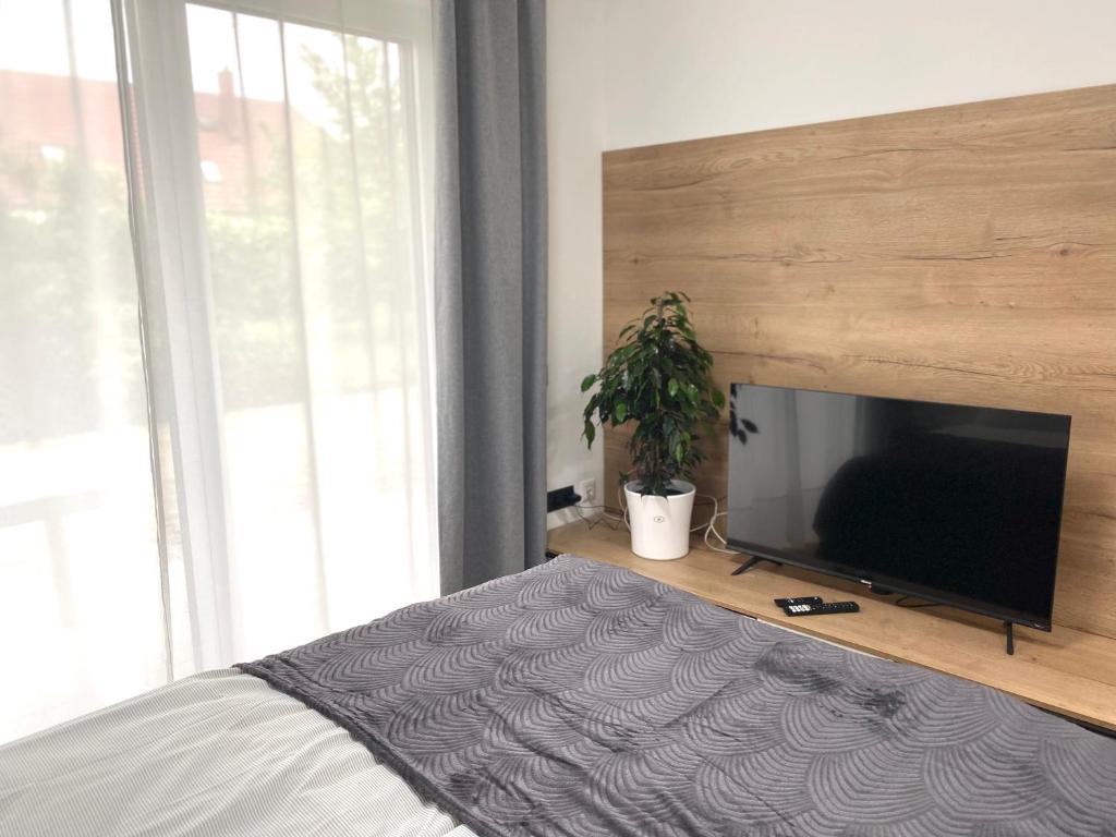Postel nebo postele na pokoji v ubytování Apartments Loim Lodge
