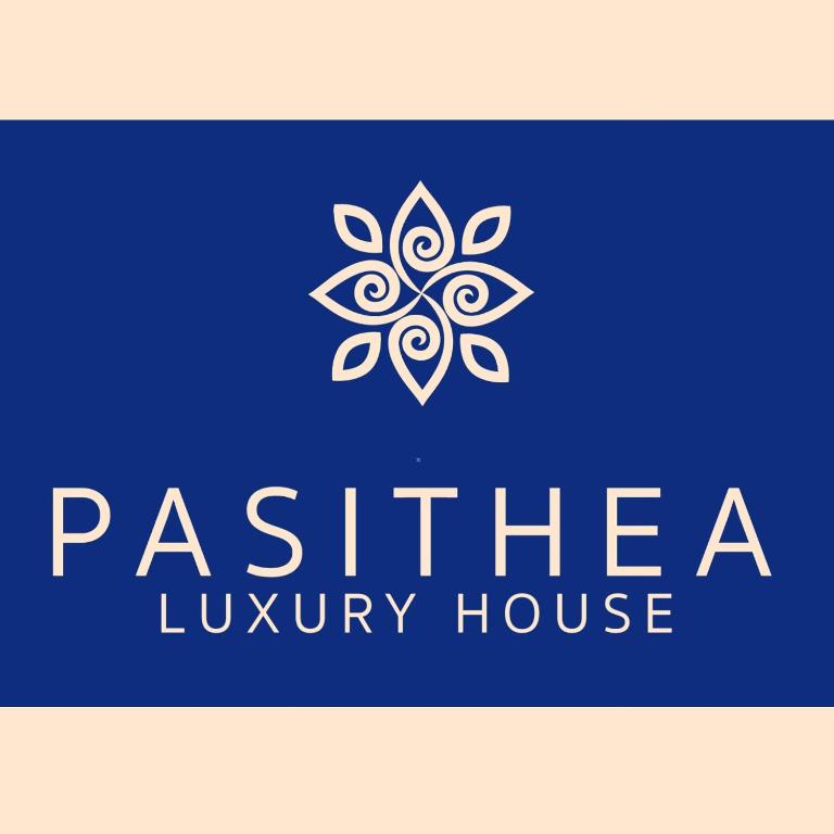 a blue and white logo for a luxury house at Pasithea Luxury house in Archangelos