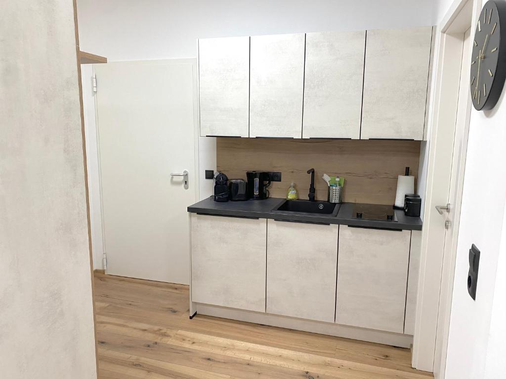 Kuchyň nebo kuchyňský kout v ubytování Apartments Loim Lodge