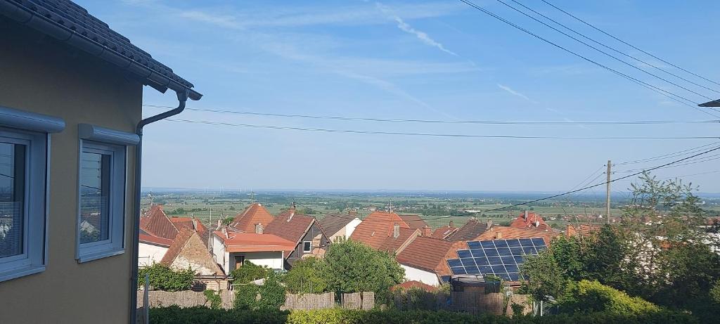 a view of roofs of houses with solar panels at Traumblick Südpfalz in Burrweiler