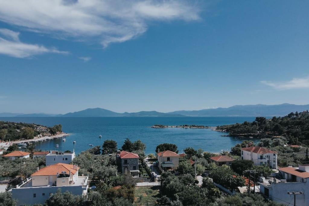 a view of a town and a body of water at Olga's Home(Σπίτι με θέα δίπλα στην θάλασσα) in Kritharia