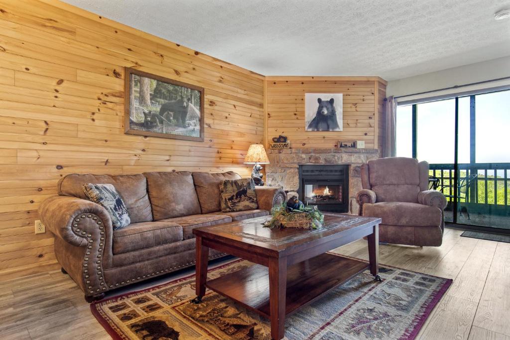 a living room with a couch and a table at Bear Cub Retreat in Gatlinburg