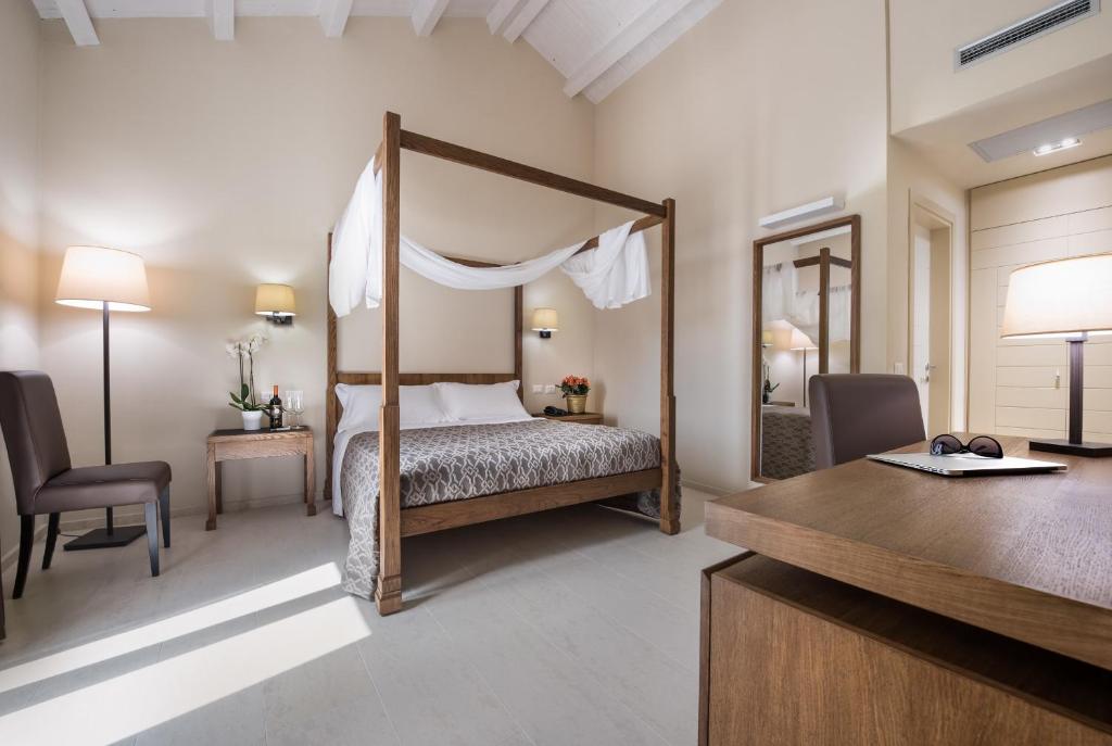 Postel nebo postele na pokoji v ubytování Firriato Hospitality - Baglio Sorìa