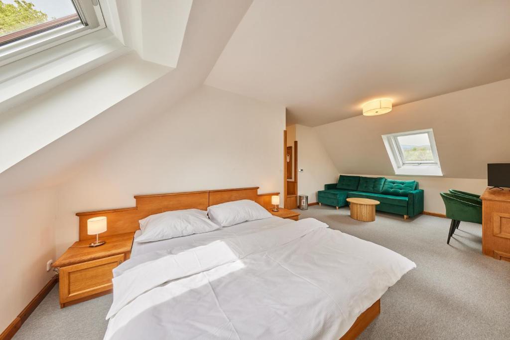 Postel nebo postele na pokoji v ubytování Hotel Auri