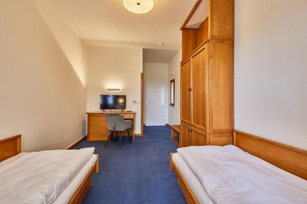 Postel nebo postele na pokoji v ubytování Hotel Auri