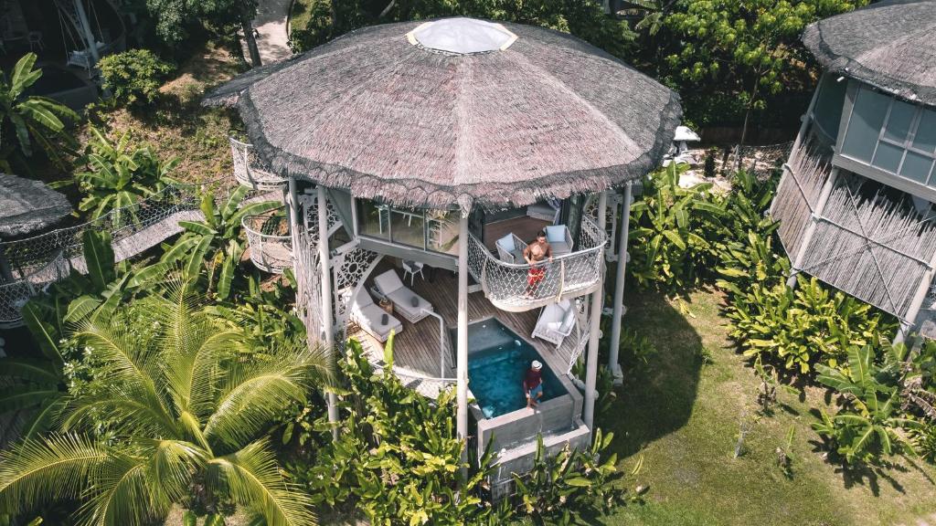 an aerial view of a gazebo with people in it at TreeHouse Villas - Adults Only - SHA Extra Plus in Ko Yao Noi