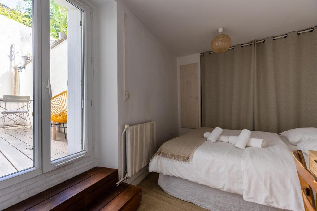 Posteľ alebo postele v izbe v ubytovaní 90m2 renové - terrasse en plein coeur de marseille