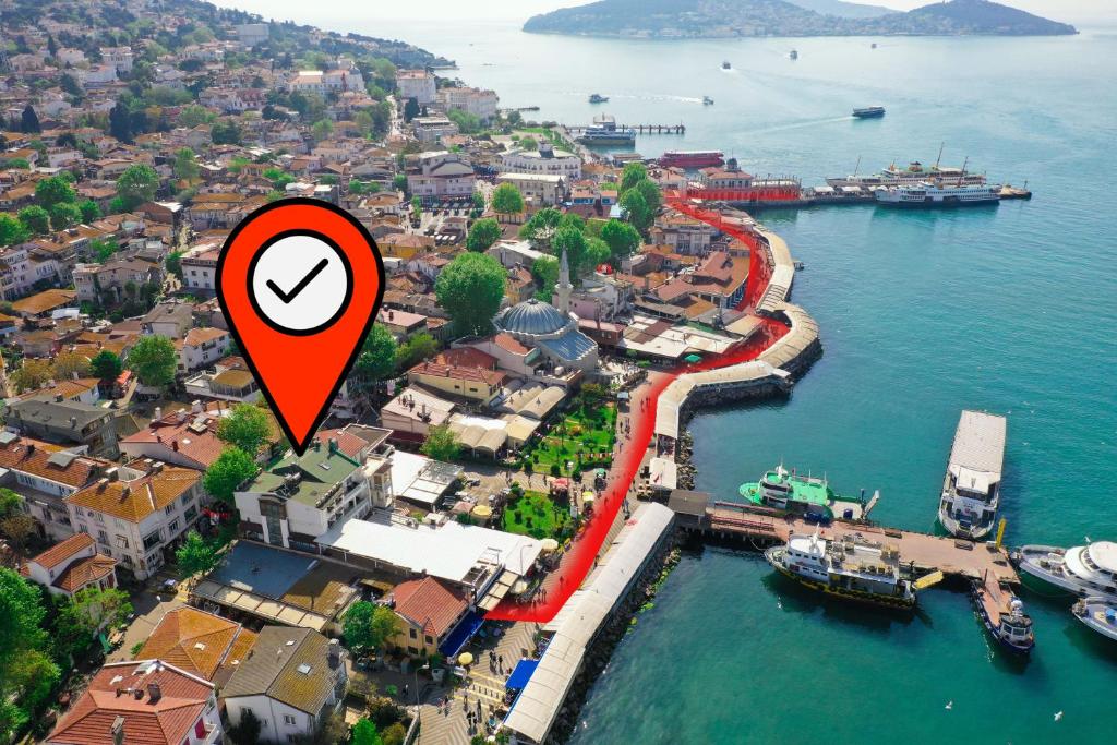 an aerial view of a city with a red arrow at My Way Tera Butik Otel in Adalar