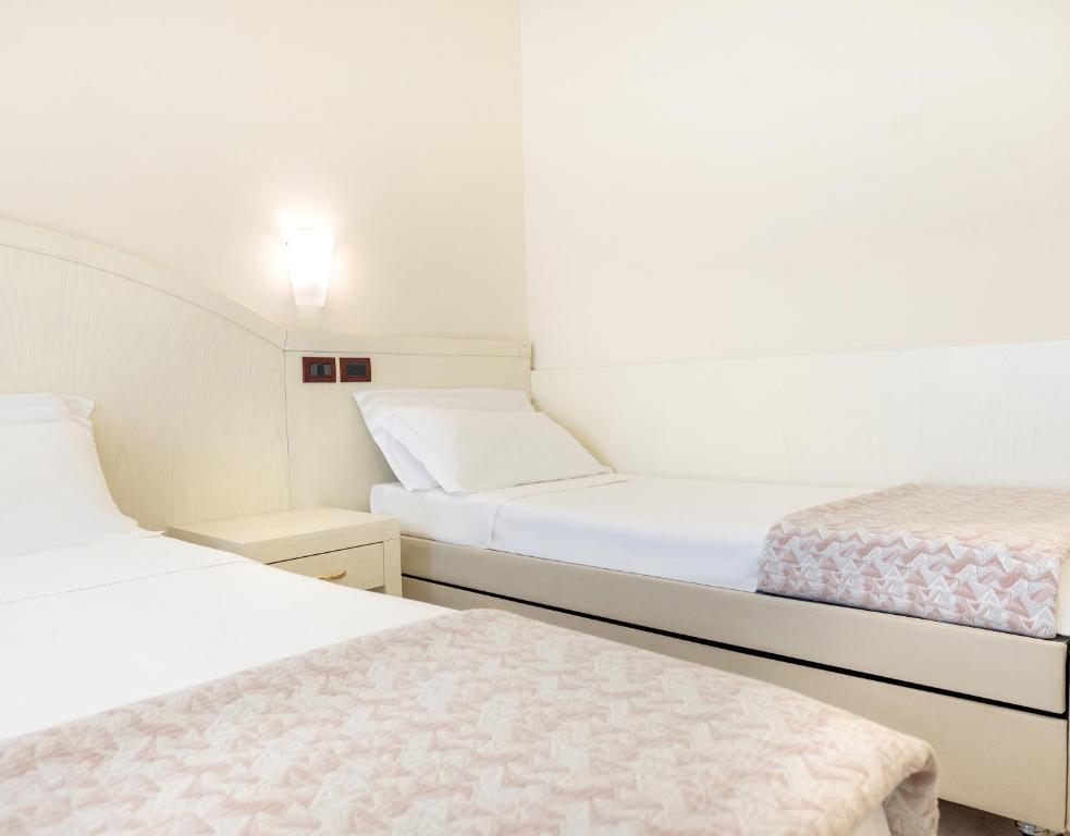 Postel nebo postele na pokoji v ubytování Hotel Fenice Gluten Free