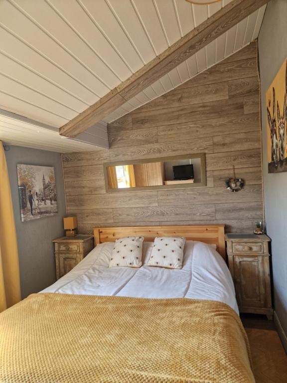 a bed with two pillows in a bedroom at Chalet 88 in Aberystwyth